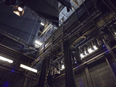 Looking up into the automation and lighting of the Milton Court Theatre